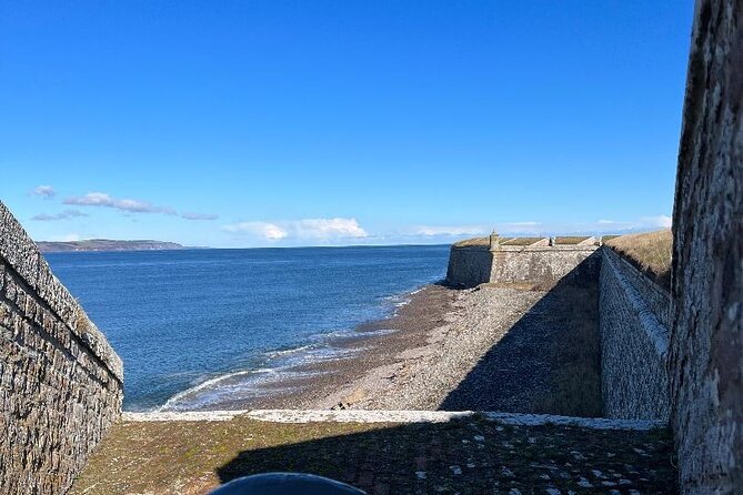 Invergordon Private Tour: Fort George, Cawdor Castle & Loch Ness - Loch Ness from Dores Beach: calm views and Nessie-watching fun